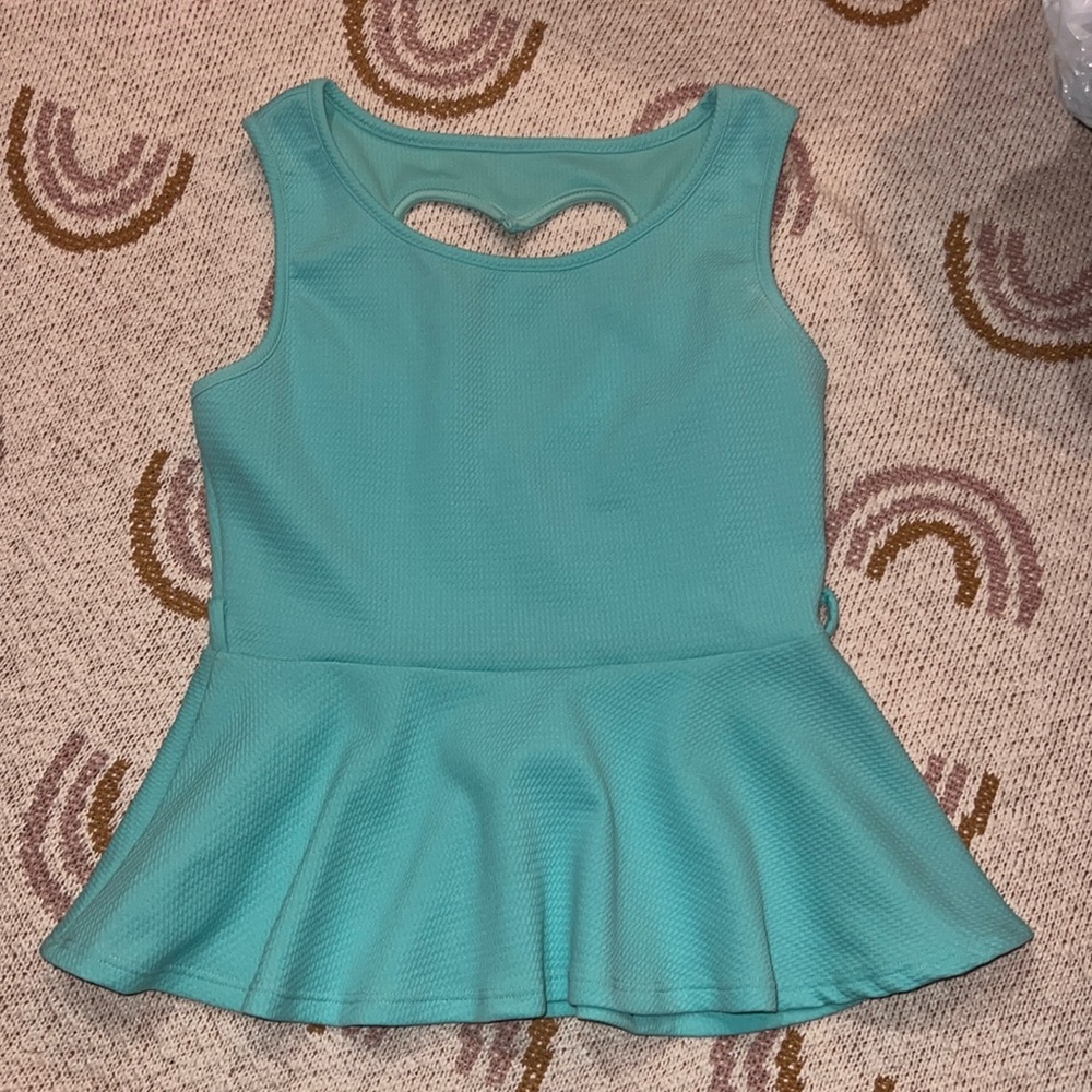Peplum sleeveless top size L heart shaped cutout back